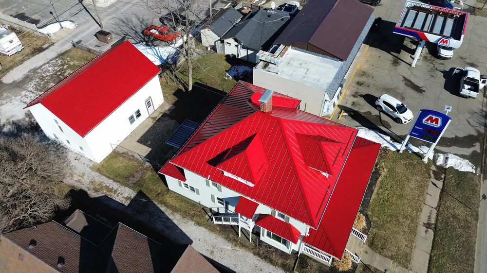 Bold red metal roof by Cedar Ridge Exteriors