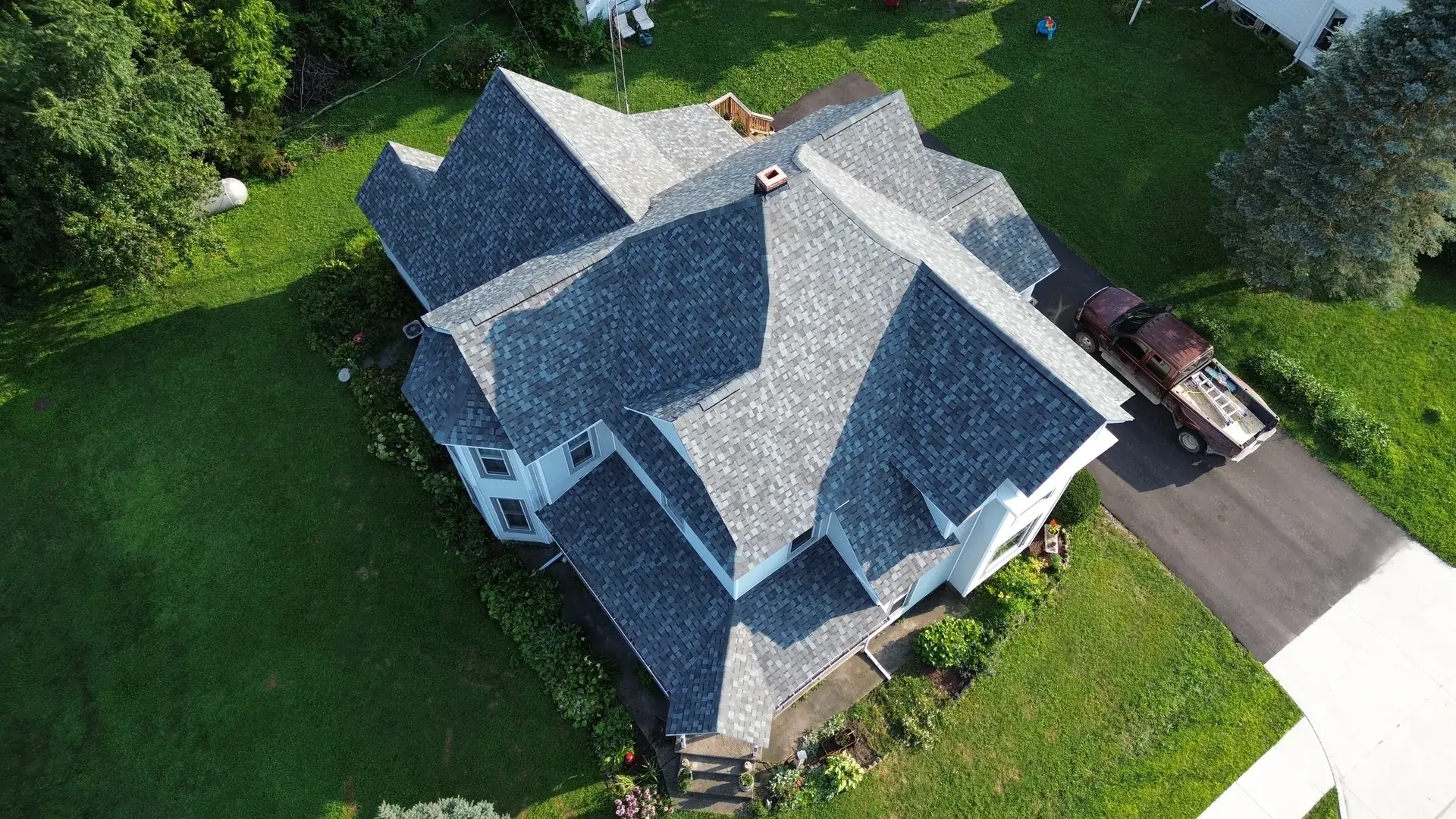 Aerial view of a completed Cedar Ridge roof at golden hour in rural Indiana