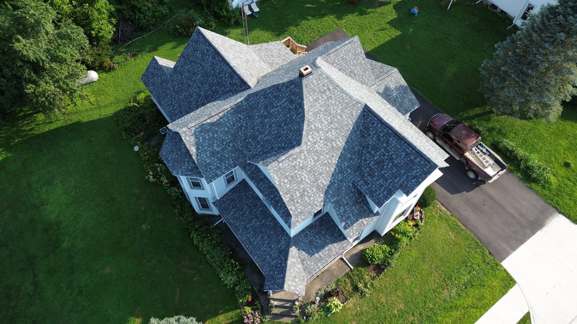 Aerial view of a completed Cedar Ridge roof at golden hour in rural Indiana